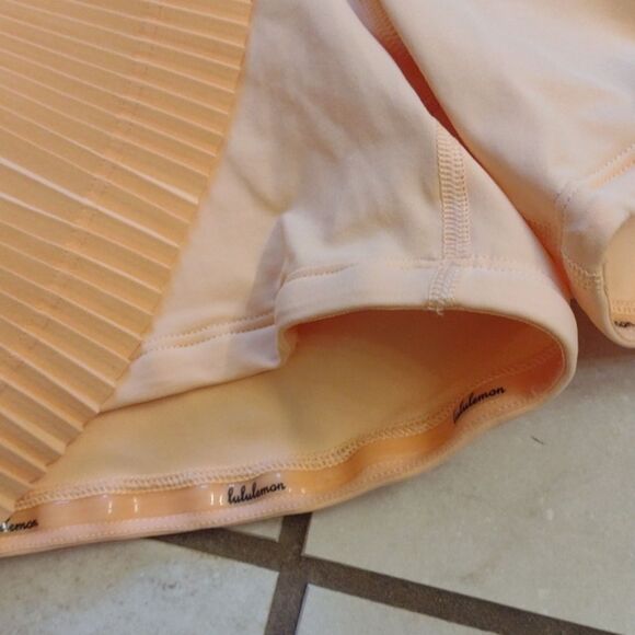 Lululemon Pleat to Street Mid-Rise Skirt Summer Glow light orange pleated 12 - Picture 9 of 14